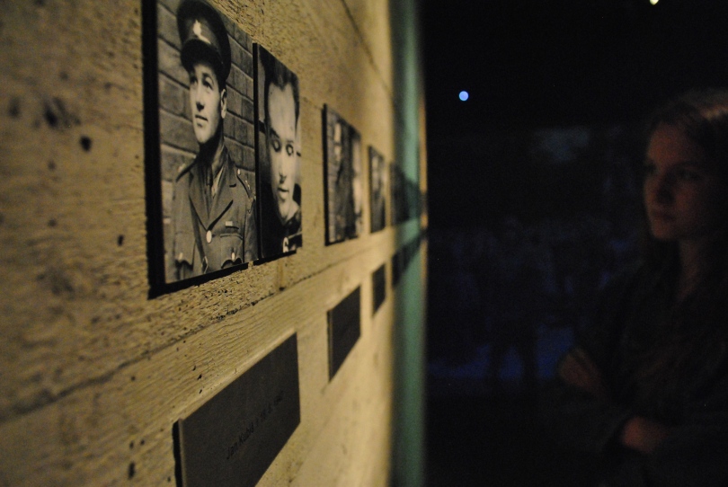 A visitor looks at the pictures of the five parachutists who hid in the crypt at the Church of St. Cyril and Methodius in central Prague after two of them assassinated Hitler's third-in-command, Reinhard Heydrich. One of the parachutists, who fled the group to hide with his mother, betrayed the other soldiers' location in the crypt to the Nazis. The picture on the right of each portrait shows the dead soldier after the Nazis found them in the crypt. They all refused to surrender. The traitor was hanged as soon as the war was over.